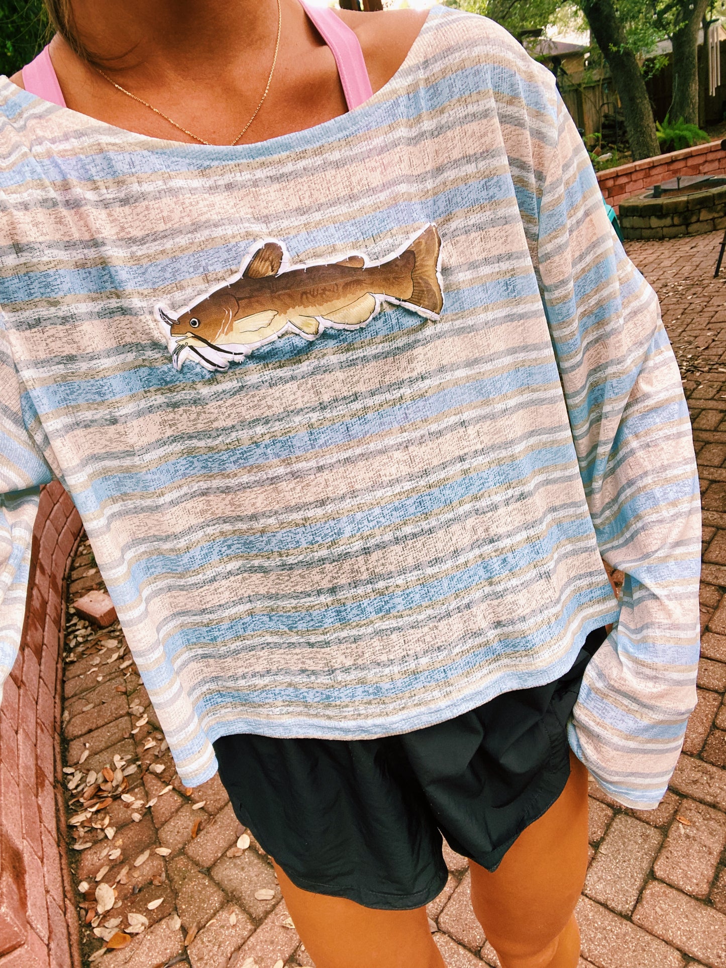 Brown and blue striped catfish sweater