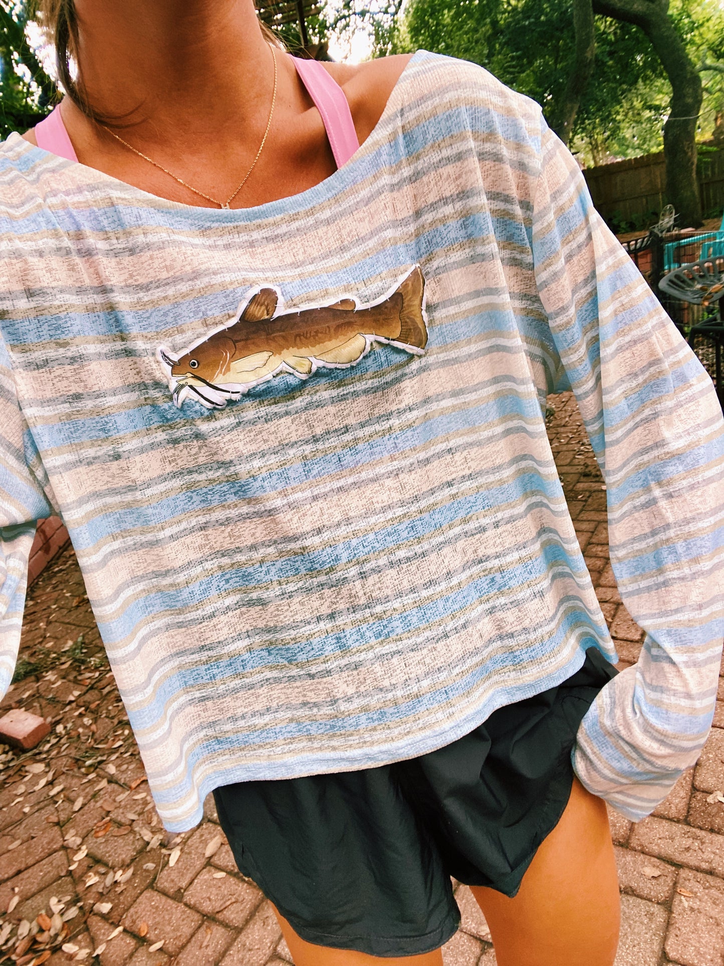 Brown and blue striped catfish sweater