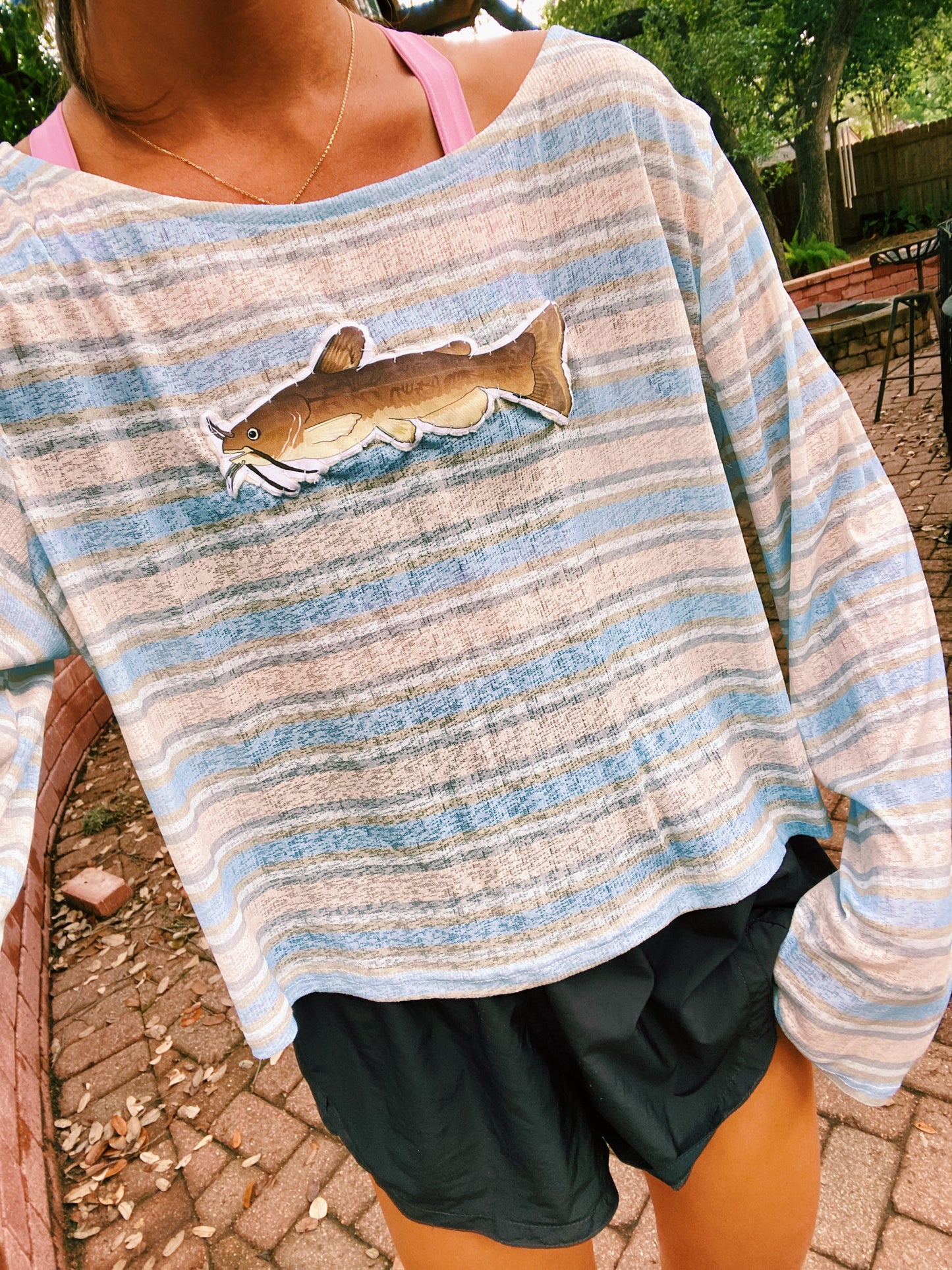 Brown and blue striped catfish sweater